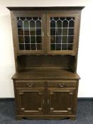 An oak leaded door dresser