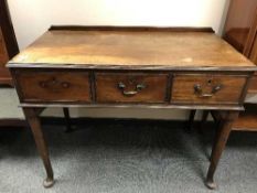 A Georgian mahogany three drawer washstand