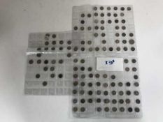 A basket of silver three penny bits