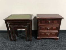 A stained beech three drawer chest and nest of tables