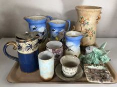 A tray of three Falcon ware jugs, Maling ash tray, Sylvac dogs,