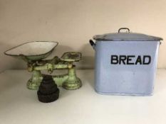 A enamelled bread bin and a set of vintage kitchen scales with weights