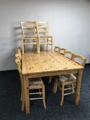 Large pine kitchen table and ten dining chairs
