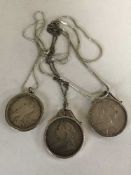 Three silver coin pendants to include a 1900 Crown,