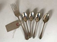 Four silver table spoons and a silver fork, 5.