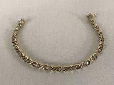 An 18ct gold bracelet set with thirty-six diamonds approximately 1ct, 14.95g.