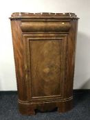 A late 19th century mahogany corner cabinet