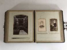 An antique leather bound photo album of monochrome photos