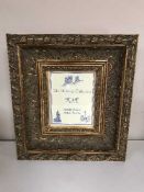 A heavy gilt photo frame