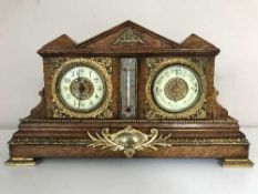 An antique oak bracket clock with gilt and enamelled dial, fitted with a barometer,