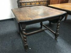 An oak flap sided dining table