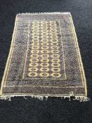 An Afghan rug on gold ground