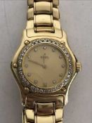A Lady's 18ct gold Ebel wristwatch with diamond dial and bezel, 85g.