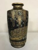 A Japanese Satsuma black and gilt vase, depicting peacocks,