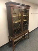 A Victorian inlaid mahogany display cabinet