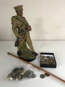 A good collection of militaria - buttons, badges, shell casing caps, swagger stick,