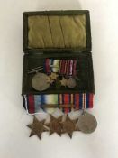 A group of four medals comprising 1939-45 Star, Atlantic Star, Burma Star and War Medal,