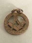 A 9ct gold Masonic pendant, 4.