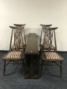 An elm Ercol drop leaf table and four chairs