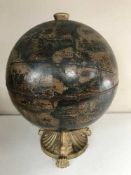 A table top globe drinks holder
