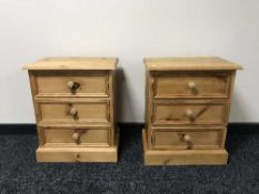 A pair of stripped pine bedside chests