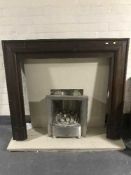 A chrome gas fire insert with marble hearth and back together with a mahogany fire surround