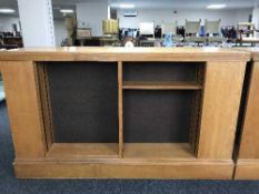 An early 20th century oak double sided library bookcase