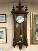 A mahogany weight driven striking 8 day Vienna wall clock