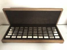 One Thousand Years of British Monarchy, a collection of fifty sterling silver ingots, each 65g,