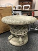 A large garden planter on lion paw feet