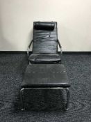 A mid 20th century Danish leather armchair and stool