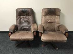 A pair of beech framed and brown leather armchairs