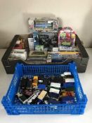 Two boxes of die cast vehicles and toys