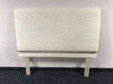 A cream upholstered 4'6 padded headboard