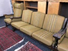 A four piece oak scroll armed suite