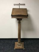 A carved oak pedestal church lectern
