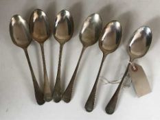 A set of six silver dessert spoons, 9.