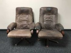A pair of beech framed and brown leather armchairs