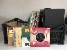 Two boxes of LP records, box sets and 45's - musicals,