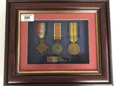 A First World War Group of three medals comprising 1914-15 Star,