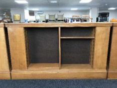 An early 20th century oak double sided library bookcase