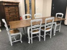 A French painted oak extending farmhouse table and six chairs