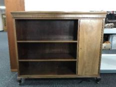 A set of mahogany open shelves fitted a cupboard