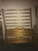 A 4'6 pine bed frame