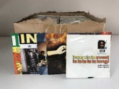 Four boxes of 45's including - The Kinks, Iron Maiden,