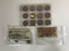 A collection of British crowns, American silver quarter dollar,