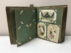 An album of early twentieth century postcards,