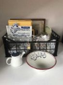 A basket of china, table linen, counter top Jubilee clothes clip stand,