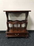 A mahogany magazine table