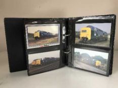 A postcard album relating to railways including a scarce card showing the railway crossing